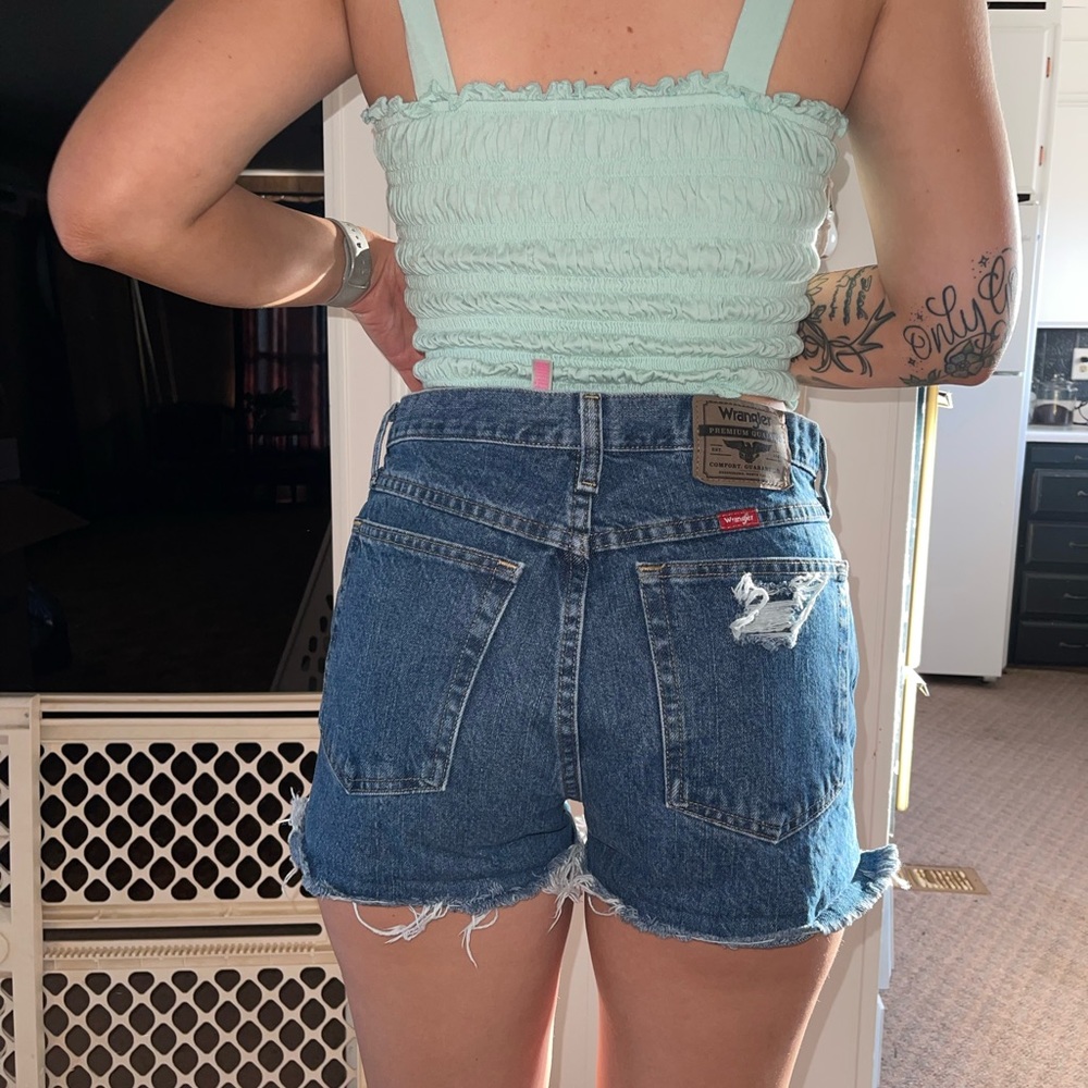 Custom Destroyed Wrangler shorts.
